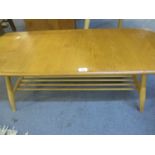 An Ercol light elm coffee table with slatted shelf below on splayed legs