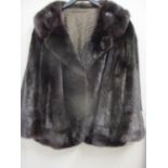 A vintage brown mink jacket with button detail to the cuffs, 25" long, approximately 42-44" chest