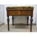 A late Victorian inlaid rosewood music stool with a hinged, upholstered seat, the frieze decorated