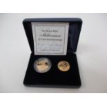 A millennium gold full sovereign in a plastic case and half sovereign of the same year, each with St