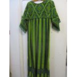 A 1970's ladies full length dress with 3/4 sleeves, in a multi green towelling fabric,