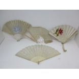 Four 19th century fans, two with cream lace leaves, the larger with carved bone sticks and two
