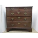 A George III mahogany chest of two short and three graduated long drawers, on bracket feet, 36 1/2"