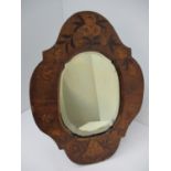 A 19th century Dutch walnut and marquetry mirror with lobed sides, decorated with flowers and a