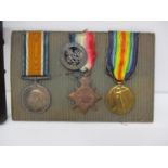 Three Great War medals, British War, a Victory and a 1914-15 Star, each stamped 103598 GNR F G