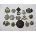 Sixteen mainly Scottish military and other cap badges, to include The Royal Scots, Lovat's Scouts,