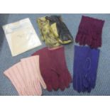 A pair of vintage sealskin gloves, three pairs of coloured suede gloves and a pair of pink kid