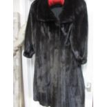 A good quality Carmen Links black full length mink coat