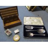 A Walker and Hall silver plated serving set, a mahogany cigarette box, a silver matchbox cover, a