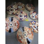 A quantity of Imari plates and bowls