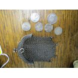 A small French silver chain mail purse, marks to top edge, containing a group of five three pence