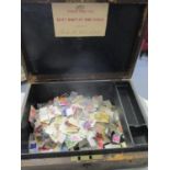 Mixed loose worldwide stamps contained within an early 20th century leather bound box