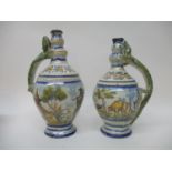 A near pair of 18th/19th century Majolica bottle vases of ovoid form, with a knopped neck, decorated