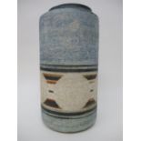 A Troika cylindrical vase decorated by Linda Taylor with roundels and lines on a blue and white