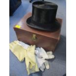 A top hat in a leather case, together with mixed gloves