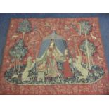 A late 20th century tapestry rug depicting a lady and her maid, flanked by a lion and a unicorn