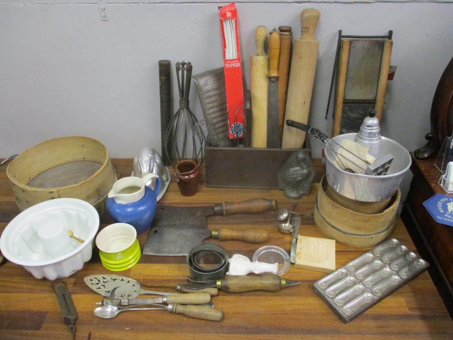 Kitchenalia to include sieves, rolling pins, china mould, cleavers, flatware, metal moulds and other