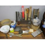 Kitchenalia to include sieves, rolling pins, china mould, cleavers, flatware, metal moulds and other