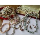 A collection of Venetian beads, seed pearl and pearl necklaces, together with faux pearl costume