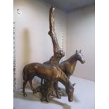 A spelter table lamp in the form of two horses by a tree, 12 1/2"h