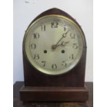 A late 19th/early 20th century mantel clock fitted with an 8-day German movement and silvered dial