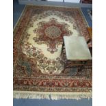 A pair of large machine woven rugs and one small