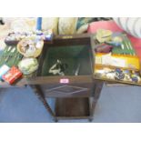 An oak early 20th century work table with barley twist supports to include the contents comprising