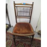 An Edwardian mahogany spindle back side chair on turned legs