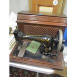 A late 19th/early 20th century cased Singer sewing machine