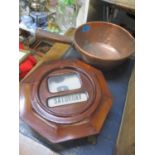 An early 20th century walnut perpetual calendar and a copper saucepan