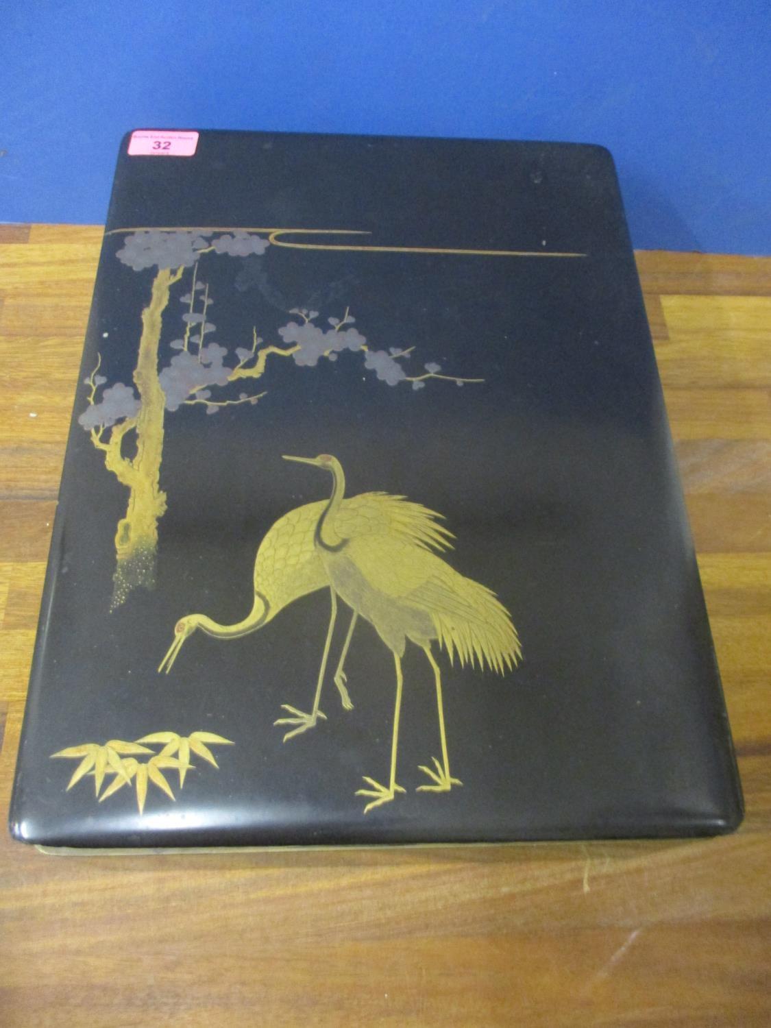 A Chinese lacquered box, A/F, 16" x 11.5" depicting two storks and fauna