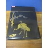 A Chinese lacquered box, A/F, 16" x 11.5" depicting two storks and fauna