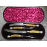 A silver topped and Antler cased carving set