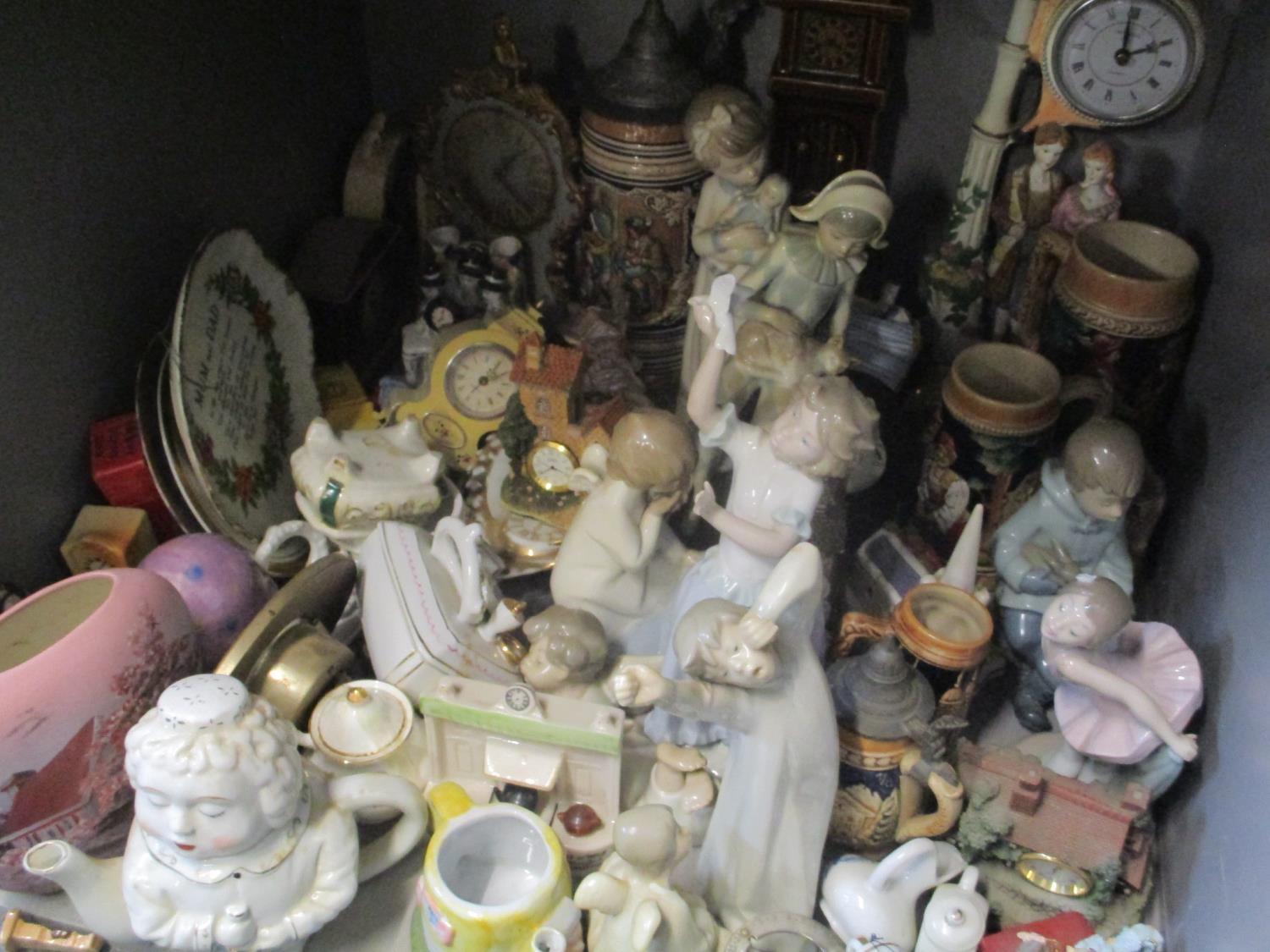 A mixed lot to include Lladro and Nao figures, a German stein and other items