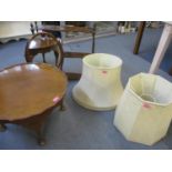 A modern mahogany open wall shelf, two large cream lampshades, an early 20th century mahogany framed