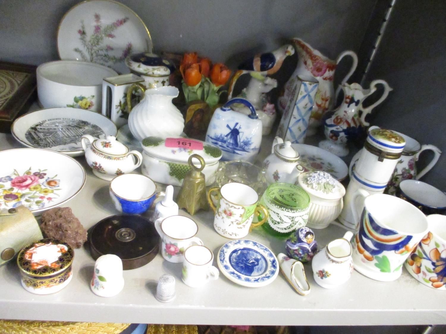 A selection of small ceramics to include a repaired Staffordshire figure of a parrot and a Crown