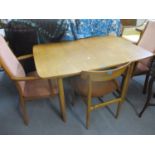 A retro G-Plan extendable dining table, together with two matching carvers and two matching dining