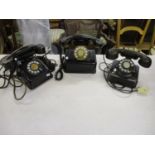 Three vintage metal and Bakelite telephones