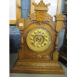 A late 19th century 20th century oak cased 8 day American mantle clock