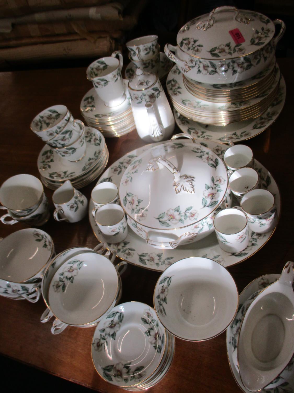 A Crown Staffordshire floral decorated dinner service comprising approximately 75 pieces