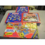 Three boxed sets of Meccano, together with a boxed Crash Dummies pin ball game
