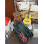 A Stentor Student ST child's violin and case, together with two children's guitars