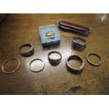 Two 22ct gold bands, one 9ct gold band and a 9ct gold signet ring, total weight 12.5g, along with