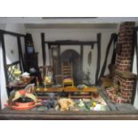 A late 20th century scratch built dolls house having only one large room with contents of a