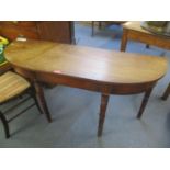 An early 19th century mahogany side table having turned legs, 28" h x 53"w