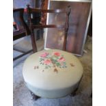 A late 19th century mahogany framed nursing chair with embroidered seat and ceramic castors