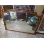 A reproduction American walnut overmantle wall mirror, 35" h x 47"w