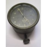 A Smiths car clock having a circular black dial with Arabic numerals