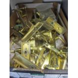 A quantity of late 20th century brass door handles