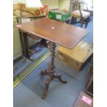 A 19th century mahogany occasional table having a square top, turned base and three cabriole legs,